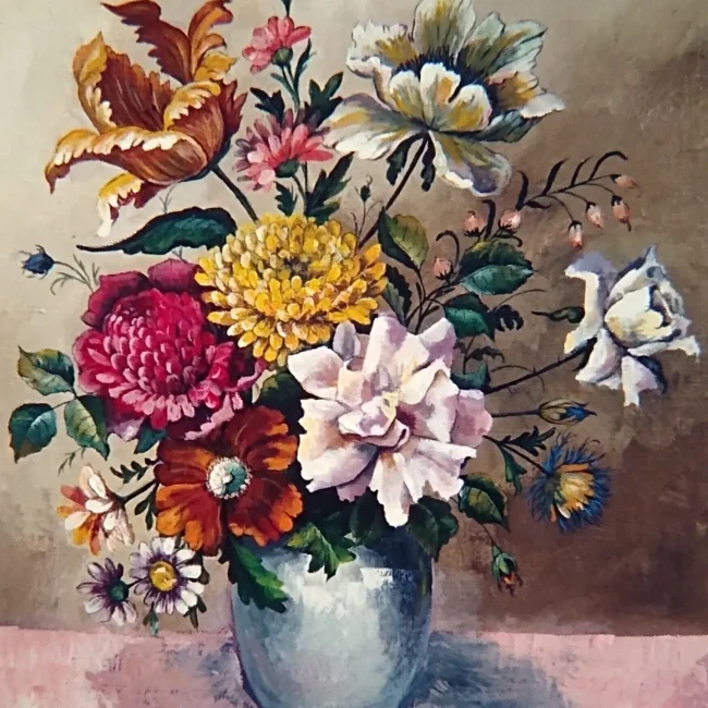 A vase containing flowers, with gentle whites contrasted by deep oranges, reds and the dark green of the leaves.