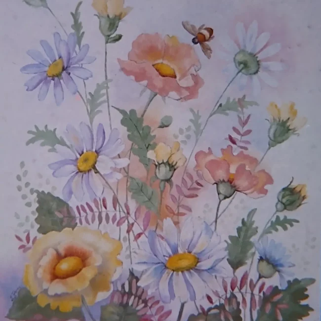 A large bee flies among pastel-colored flowers set against a whitish background into which the leaves seem to fade, as if it were fog.